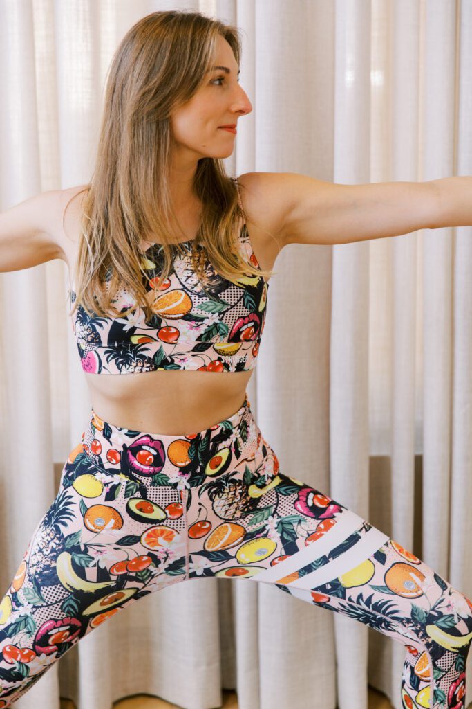 Astrid in yoga pose wearing fruit printed sports set from stronger | Ode2style.com
