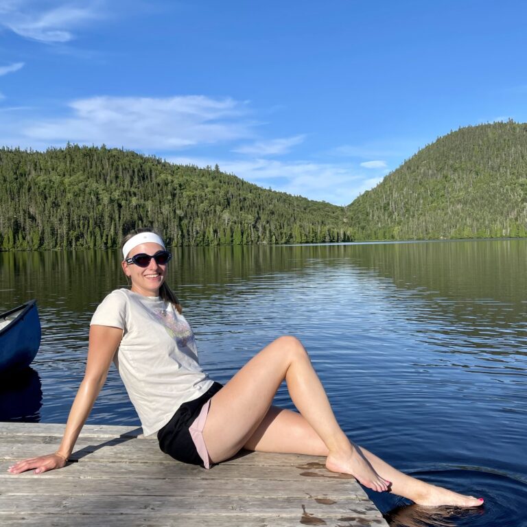 Astrid lounging on a deck at Lac de Sable, Saguenay, Canada | Ode2style.com