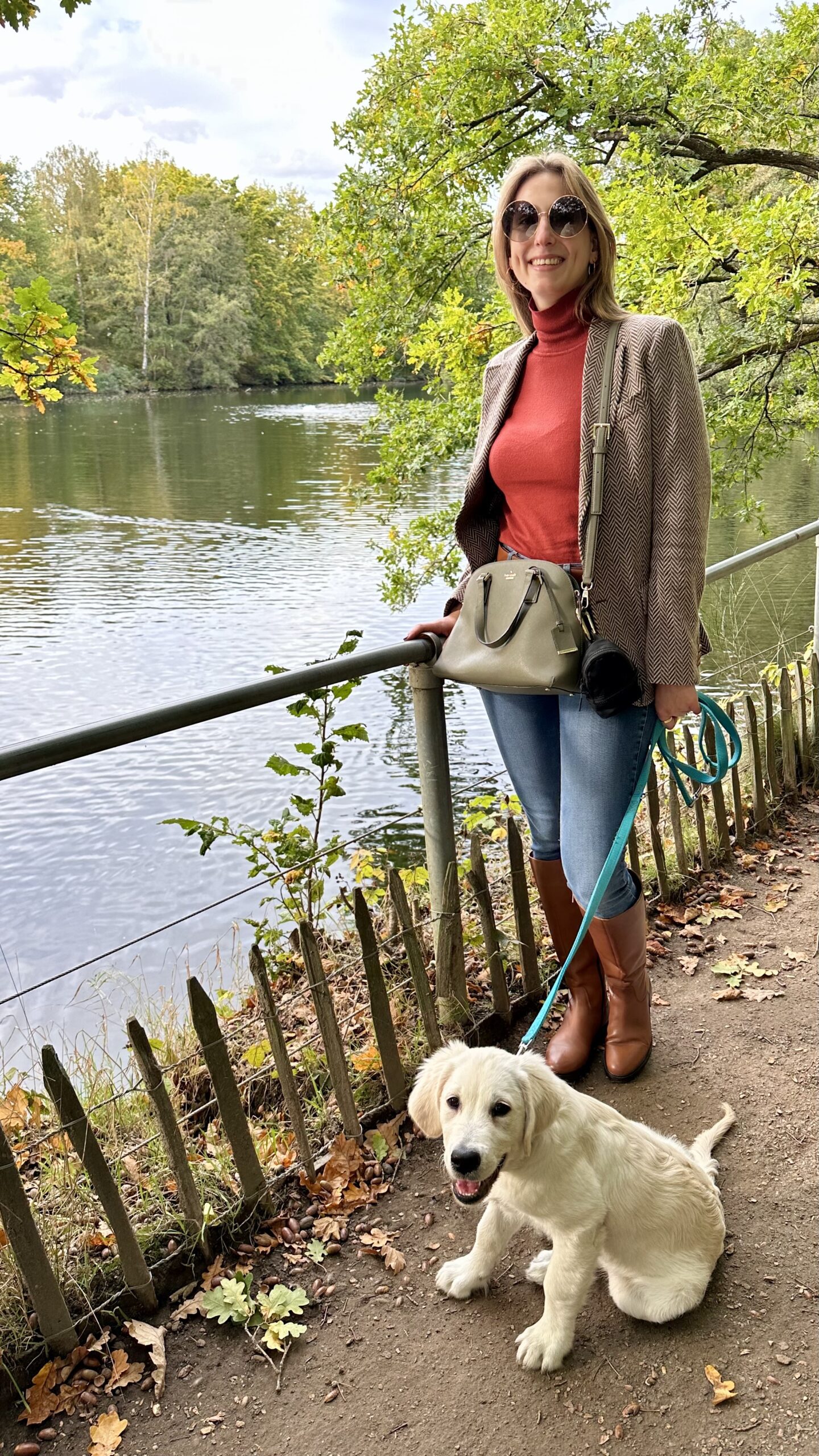 Astrid in a park wearing an equestrian inspired outfit with a puppy golden retriever | Ode2style.com