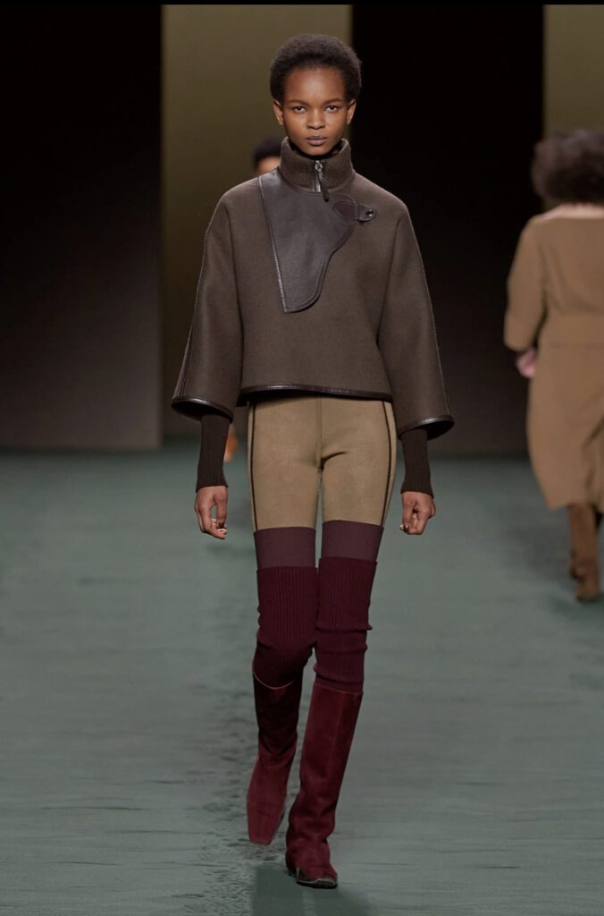 Equestrian inspired look from the Hermes AW23 show with tall burgundy boots | Ode2style.com
