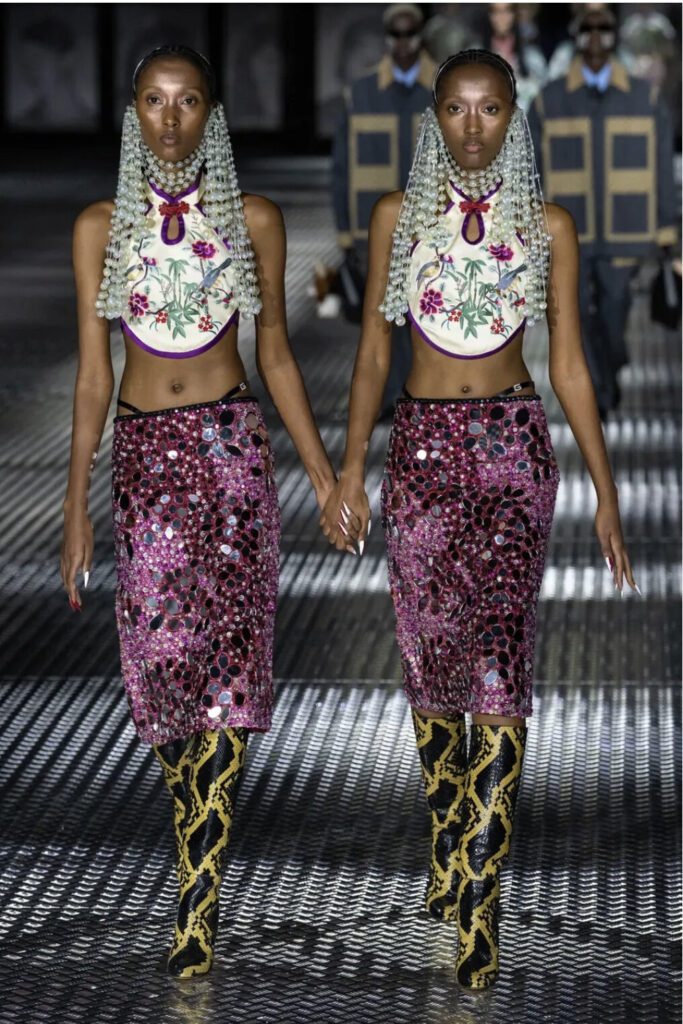 Twin models on the catwalk of Gucci's SS 23 show designed by Alessandro Michele | Ode2style.com